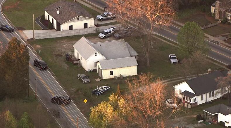SWAT officials surrounded a house in Covington on Wednesday evening. (Credit: Channel 2 Action News)