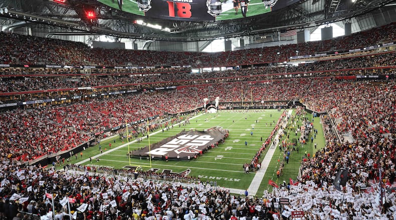 Falcons fans cheer as Atlanta Falcons quarterback Kirk Cousins (18) is being presented moments before the game against the Pittsburgh Steelers on Sunday, Sept. 8, 2024, at Mercedes-Benz Stadium in Atlanta. 
(Miguel Martinez/ AJC)