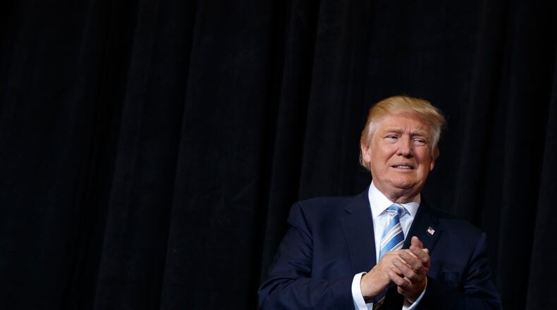 FILE - In this Nov. 7, 2016 file photo, Donald Trump arrives to speak at a campaign rally in Sarasota, Fla. Trump’s disavowal this week of white supremacists who have cheered his election as president hasn’t quieted concerns about the movement’s impact on his White House or whether more acts of hate will be carried out in his name. (AP Photo/ Evan Vucci, File)