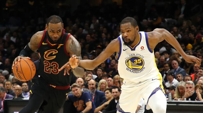 CLEVELAND, OH - JUNE 08: LeBron James #23 of the Cleveland Cavaliers handles the ball against Kevin Durant #35 of the Golden State Warriors in the second half during Game Four of the 2018 NBA Finals at Quicken Loans Arena on June 8, 2018 in Cleveland, Ohio. NOTE TO USER: User expressly acknowledges and agrees that, by downloading and or using this photograph, User is consenting to the terms and conditions of the Getty Images License Agreement. (Photo by Gregory Shamus/Getty Images) ORG XMIT: 775170288 ORIG FILE ID: 970178216