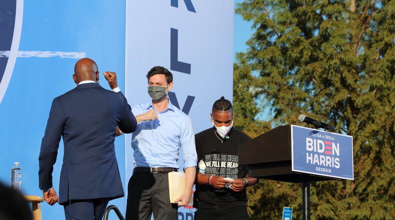 Georgia Democratic U.S. Senate candidate the Rev. Raphael Warnock bumping elbows with Democratic U.S. Senate candidate Jon Ossoff on Friday, October 23, 2020.  Contributed by Derrian Carter