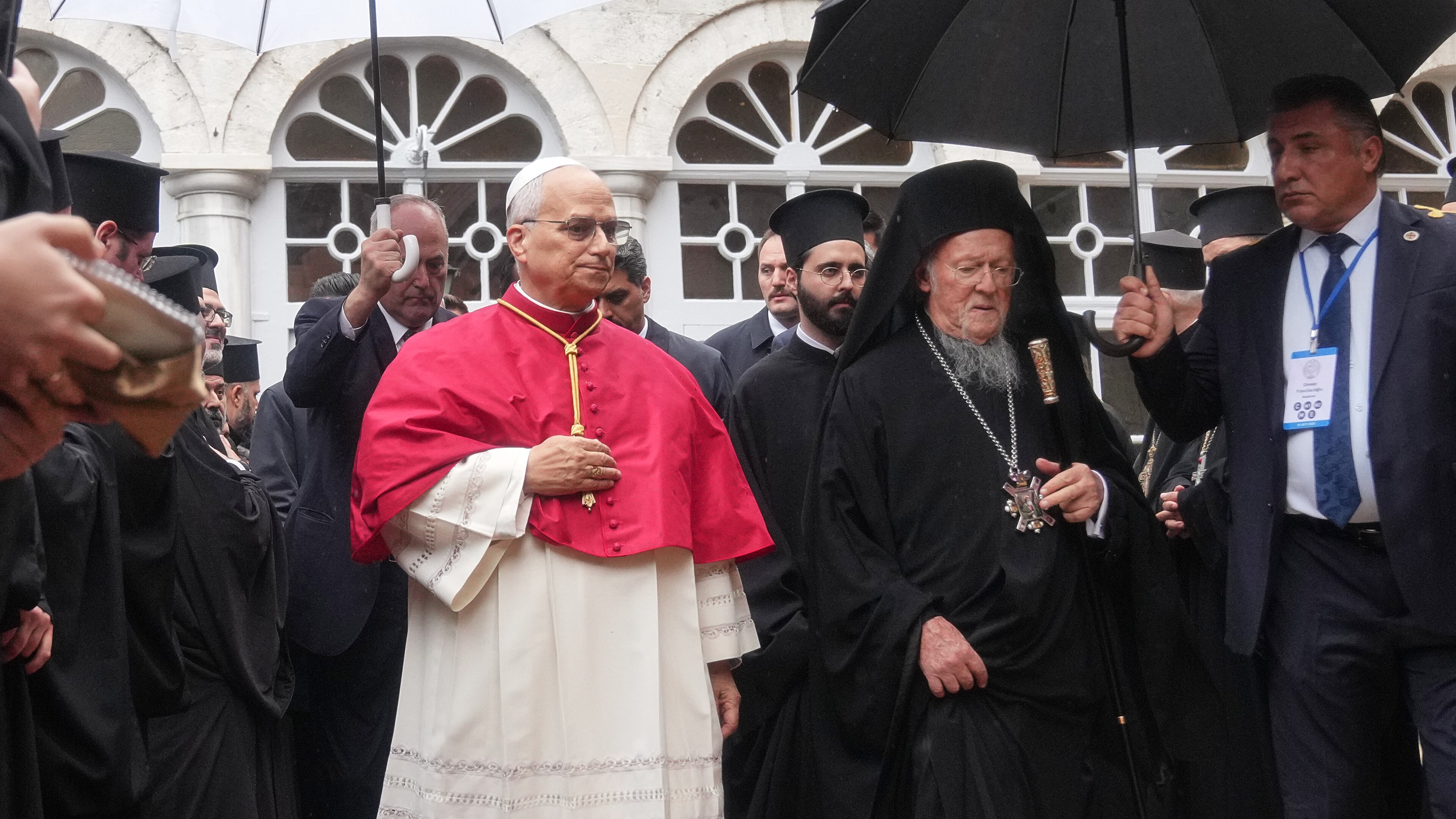 Pope Leo XIV and Ecumenical Patriarch Bartholomew I, the spiritual leader of the world's Eastern Orthodox Christians leave after a doxology service at the Patriarchal Church of Saint George, in Istanbul, Turkey, Saturday, Nov. 29, 2025. (AP Photo/Francisco Seco)