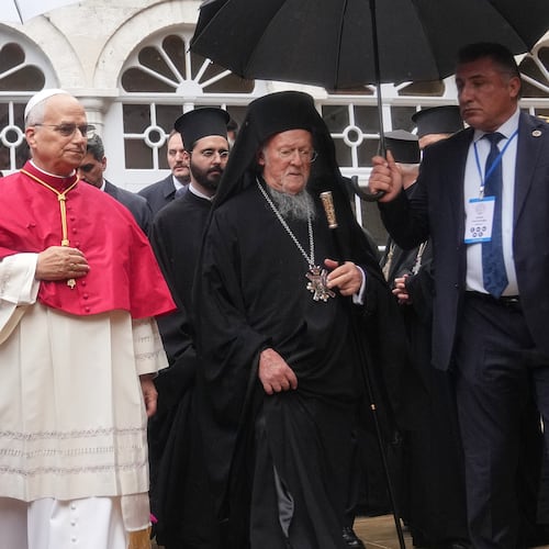 Pope Leo XIV and Ecumenical Patriarch Bartholomew I, the spiritual leader of the world's Eastern Orthodox Christians leave after a doxology service at the Patriarchal Church of Saint George, in Istanbul, Turkey, Saturday, Nov. 29, 2025. (AP Photo/Francisco Seco)