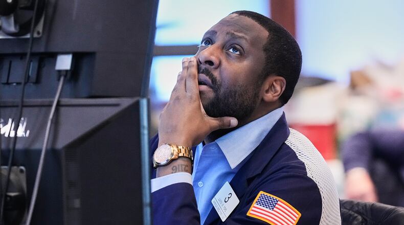 Trader Aaron Ford works on the floor of the New York Stock Exchange, Thursday, May 7, 2026. (AP Photo/Richard Drew)