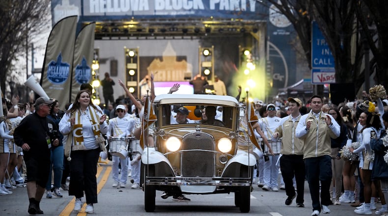 Georgia Tech's Ramblin' Wreck leads the band, cheerleaders, Buzz, players, and coaches before the start of the Georgia Tech against Georgia at Georgia Tech's Bobby Dodd Stadium, Saturday, November 25, 2023, in Atlanta. (Hyosub Shin / Hyosub.Shin@ajc.com)