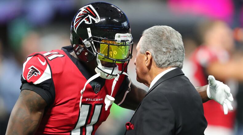 Julio Jones gives Falcons owner Arthur Blank a hug before playing the Cowboys Sunday, Nov. 12, 2017, in Atlanta.