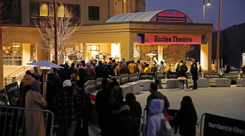 Audience members line up outside the Eccles Theatre during the Sundance Film Festival on Friday, Jan. 23, 2026, in Park City, Utah. (Photo by Charles Sykes/Invision/AP)