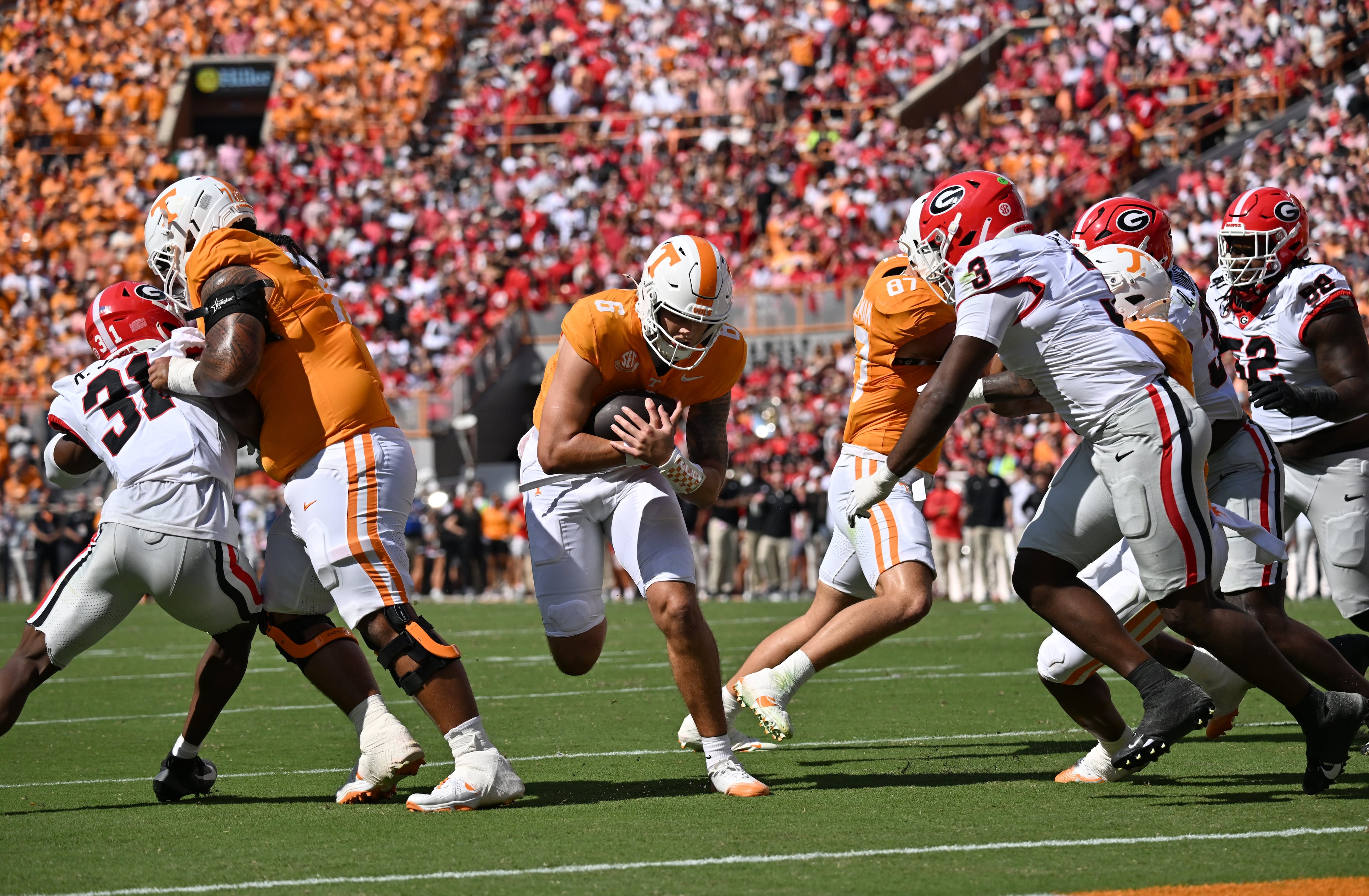 Tennessee quarterback Joey Aguilar (center) runs for a touchdown during the first half against Georgia at Neyland Stadium on Saturday, Sept. 13, 2025, in Knoxville, Tenn. (Hyosub Shin/AJC)