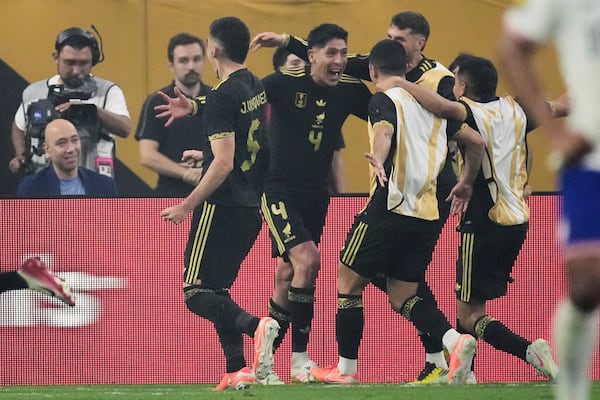 Mexico midfielder Edson Álvarez (4) celebrates with teammates after scoring in the second half of the CONCACAF Gold Cup final soccer match against the United States in Houston, Sunday, July 6, 2025. (AP Photo/David J. Phillip)