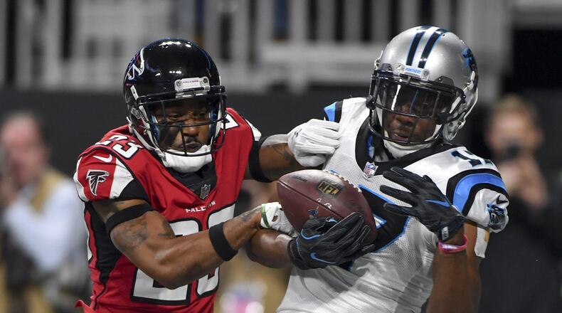 010118 Atlanta: Carolina Panthers wide receiver Devin Funchess hauls in a Cam Newton touchdown pass in front of Atlanta Falcons cornerback Robert Alford during the first half Sunday December 31, 2017. Photo by Brant Sanderlin/AJC