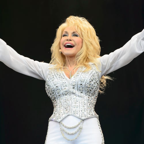 FILE - Dolly Parton performs at Glastonbury music festival, June 29, 2014. (Photo by Jonathan Short/Invision/AP, File)