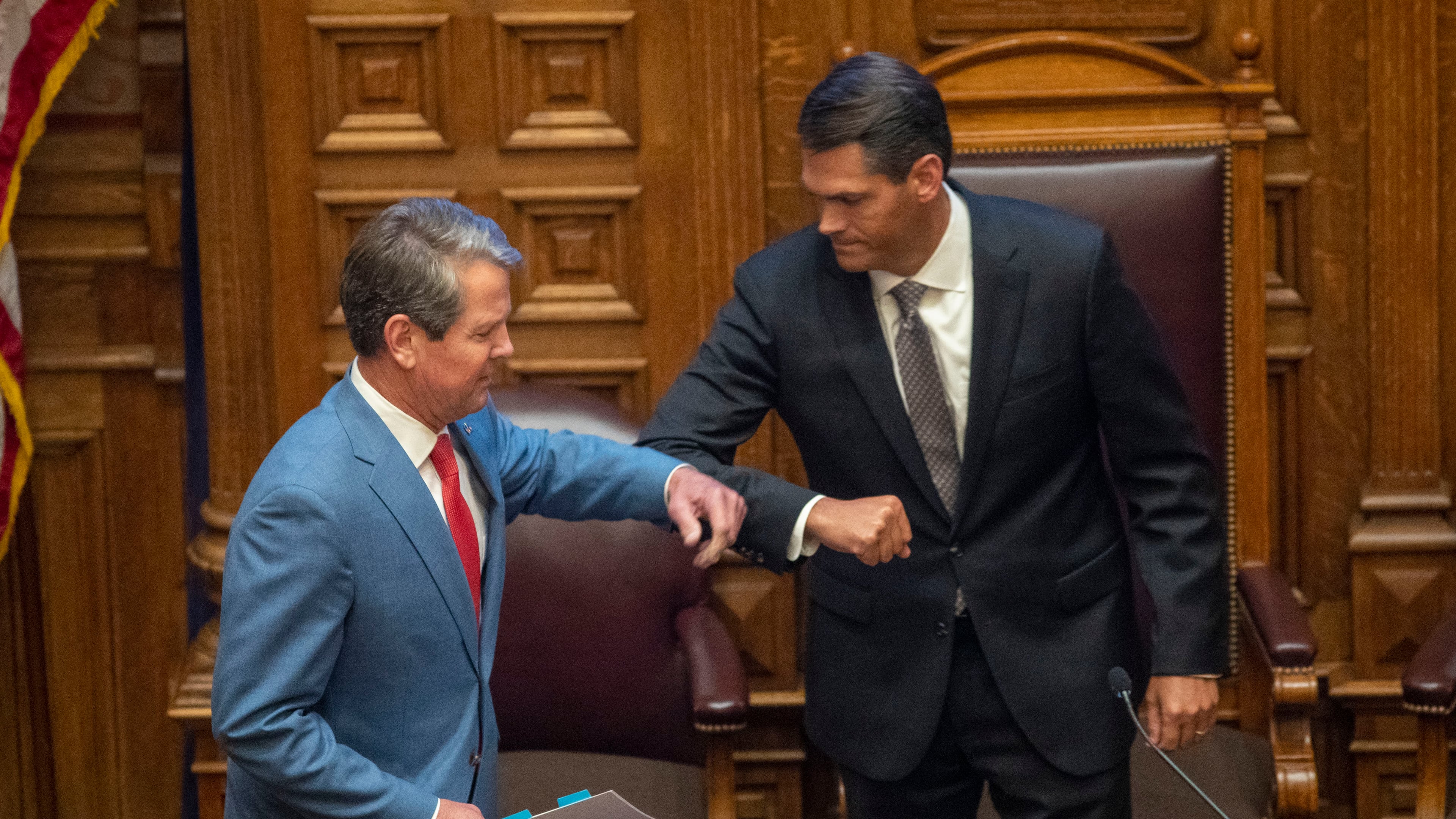 Gov. Brian Kemp greets Lt. Gov. Geoff Duncan, right, before speaking to members of the Georgia Senate in the Senate Chambers on Sine Die, day 40, of the legislative session in Atlanta, Friday, June 26, 2020. (Alyssa Pointer/AJC)