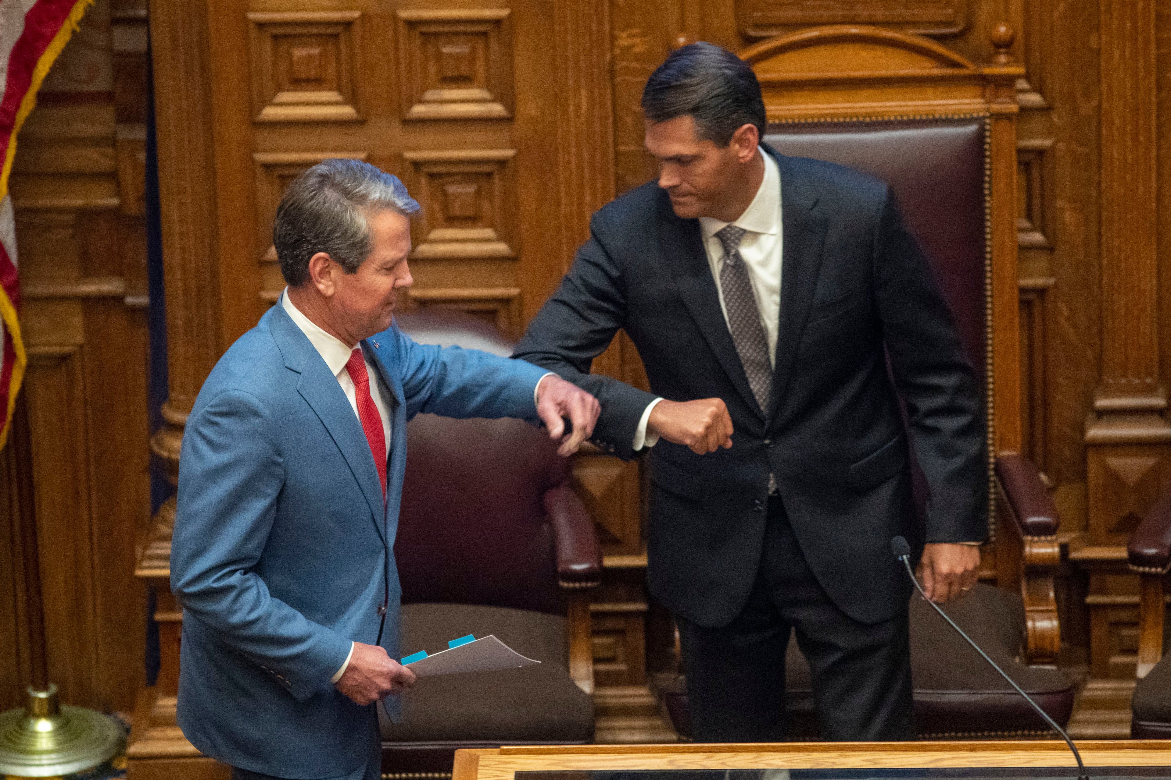 Gov. Brian Kemp greets then-Lt. Gov. Geoff Duncan, right, before speaking to members of the Georgia Senate in the Senate Chambers on Sine Die, day 40, of the legislative session in Atlanta, Friday, June 26, 2020. (Alyssa Pointer/AJC)