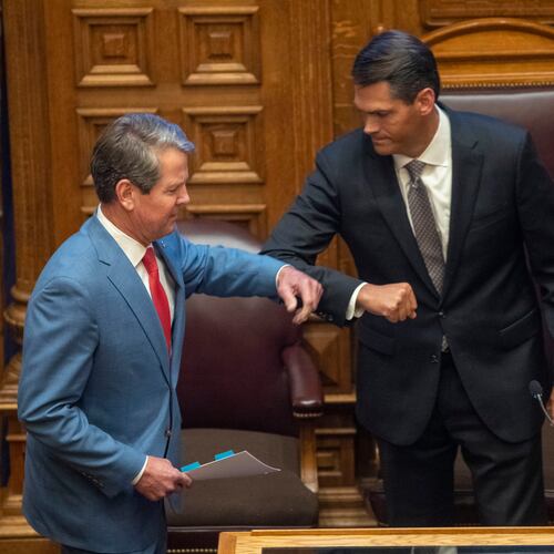 Gov. Brian Kemp greets Lt. Gov. Geoff Duncan, right, before speaking to members of the Georgia Senate in the Senate Chambers on Sine Die, day 40, of the legislative session in Atlanta, Friday, June 26, 2020. (Alyssa Pointer/AJC)