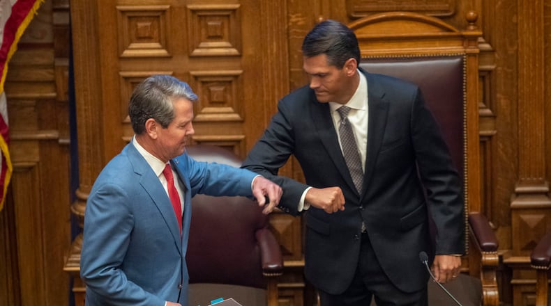 Gov. Brian Kemp greets Lt. Gov. Geoff Duncan, right, before speaking to members of the Georgia Senate in the Senate Chambers on Sine Die, day 40, of the legislative session in Atlanta on June 26, 2020. (ALYSSA POINTER / ALYSSA.POINTER@AJC.COM)