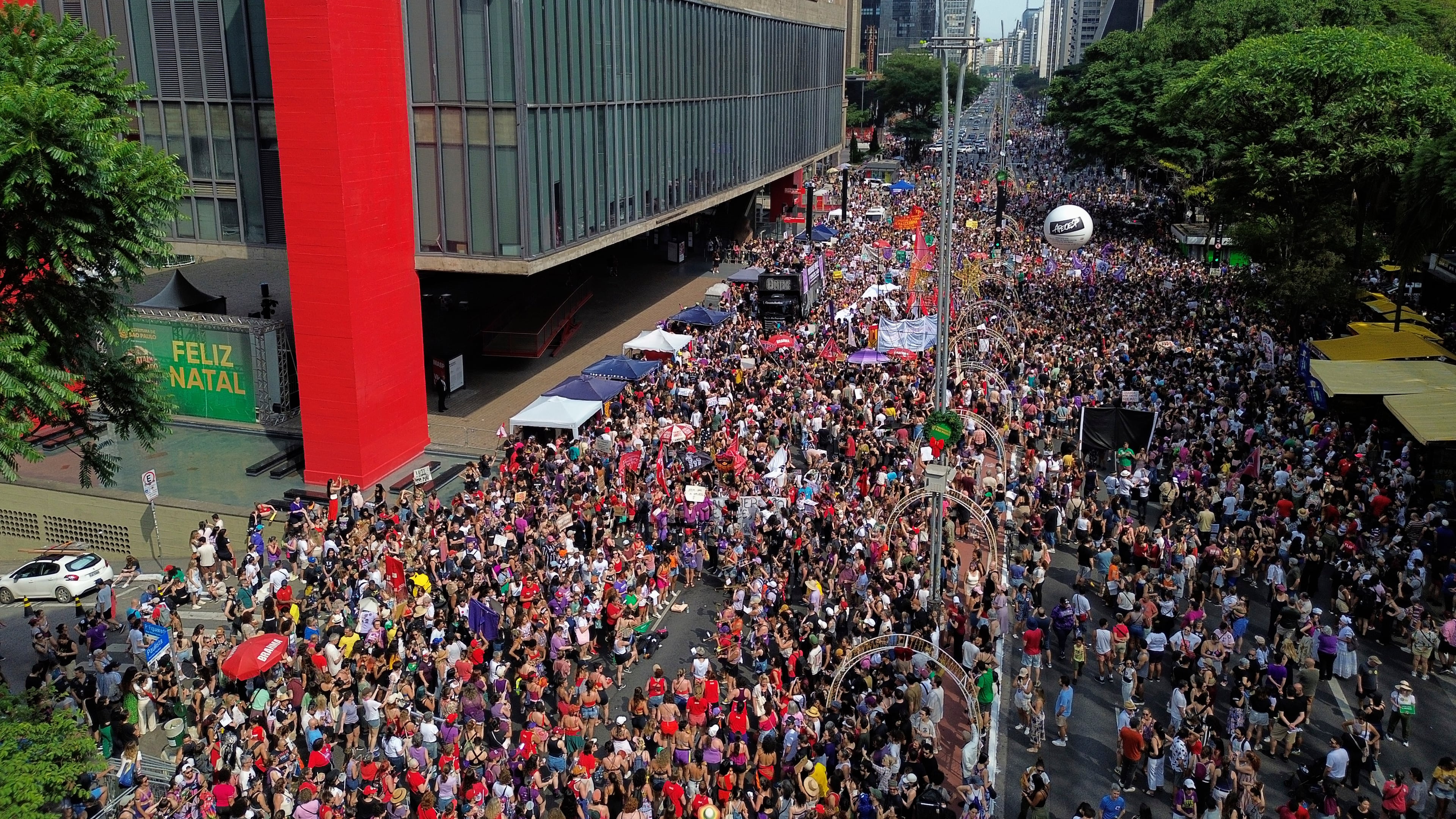 Demonstrators take parte in a march against femicide following a series of high-profile cases in the country, in Sao Paulo, Sunday, Dec. 7, 2025. (AP Photo/Ettore Chiereguini)