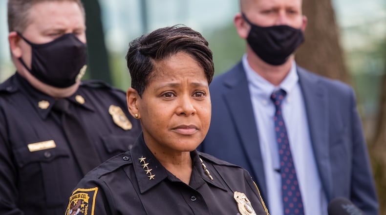 DeKalb County Police Chief Mirtha Ramos, at podium, leads a press conference Thursday, March 18, 2021 announcing the reunion of 1-year-old Royalty Grisby with her mother after the child was taken by a 14-year-old in a stolen car 12 hours earlier. (Jenni Girtman for The Atlanta Journal-Constitution)
