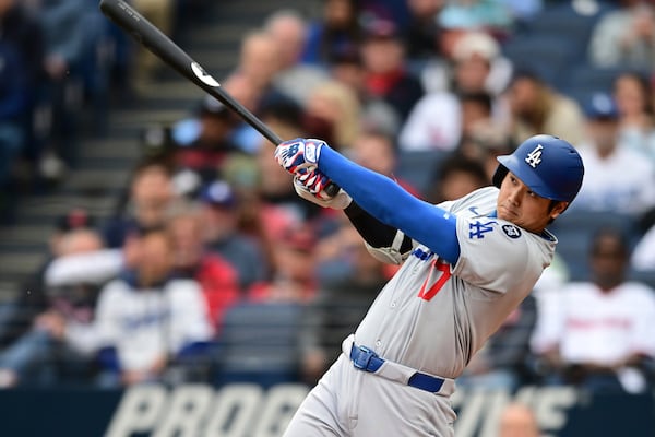 Los Angeles Dodgers' Shohei Ohtani watches his ball after hitting a two run home run off Cleveland Guardians starting pitcher Tanner Bibee during the fourth inning of a baseball game, Tuesday, May 27, 2025, in Cleveland. (AP Photo/David Dermer)