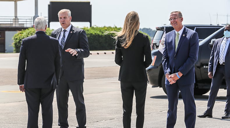Congressman Barry Loudermilk speaks with Vice President Mike Pence (second from left) as U.S. Sen. Kelly Loeffler speaks with Congressman Doug Collins (right) after Pence arrived on Air Force Two at Dobbins Air Reserve Base on Friday, May 22, 2020. (Photo: JOHN SPINK/JSPINK@AJC.COM)