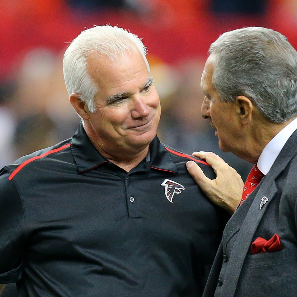 121414 ATLANTA: Falcons head coach Mike Smith and team owner Arthur Blank greet each other before playing the Steelers in a football on Sunday, Dec. 14, 2014, in Atlanta. CURTIS COMPTON / CCOMPTON@AJC.COM