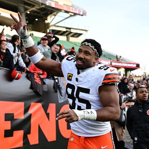 FILE - Cleveland Browns defensive end Myles Garrett celebrates with fans after an NFL football game against the Cincinnati Bengals in Cincinnati, Jan. 4, 2026. (AP Photo/David Dermer, File)