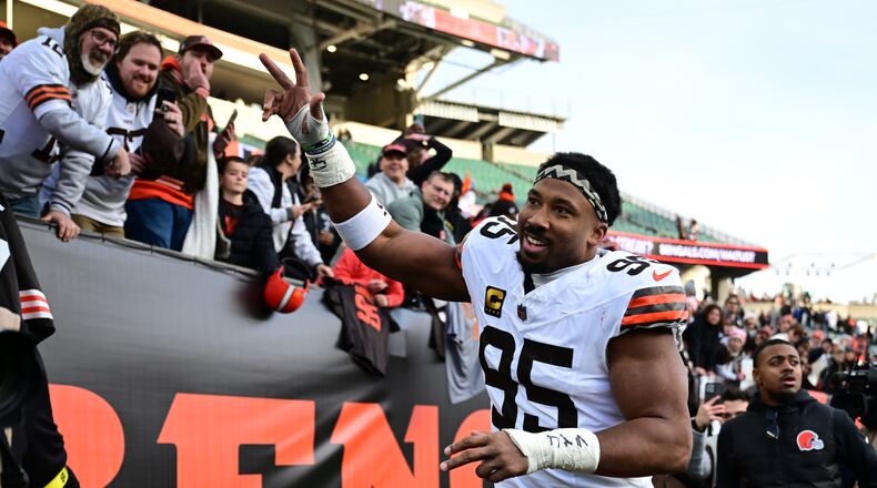 FILE - Cleveland Browns defensive end Myles Garrett celebrates with fans after an NFL football game against the Cincinnati Bengals in Cincinnati, Jan. 4, 2026. (AP Photo/David Dermer, File)