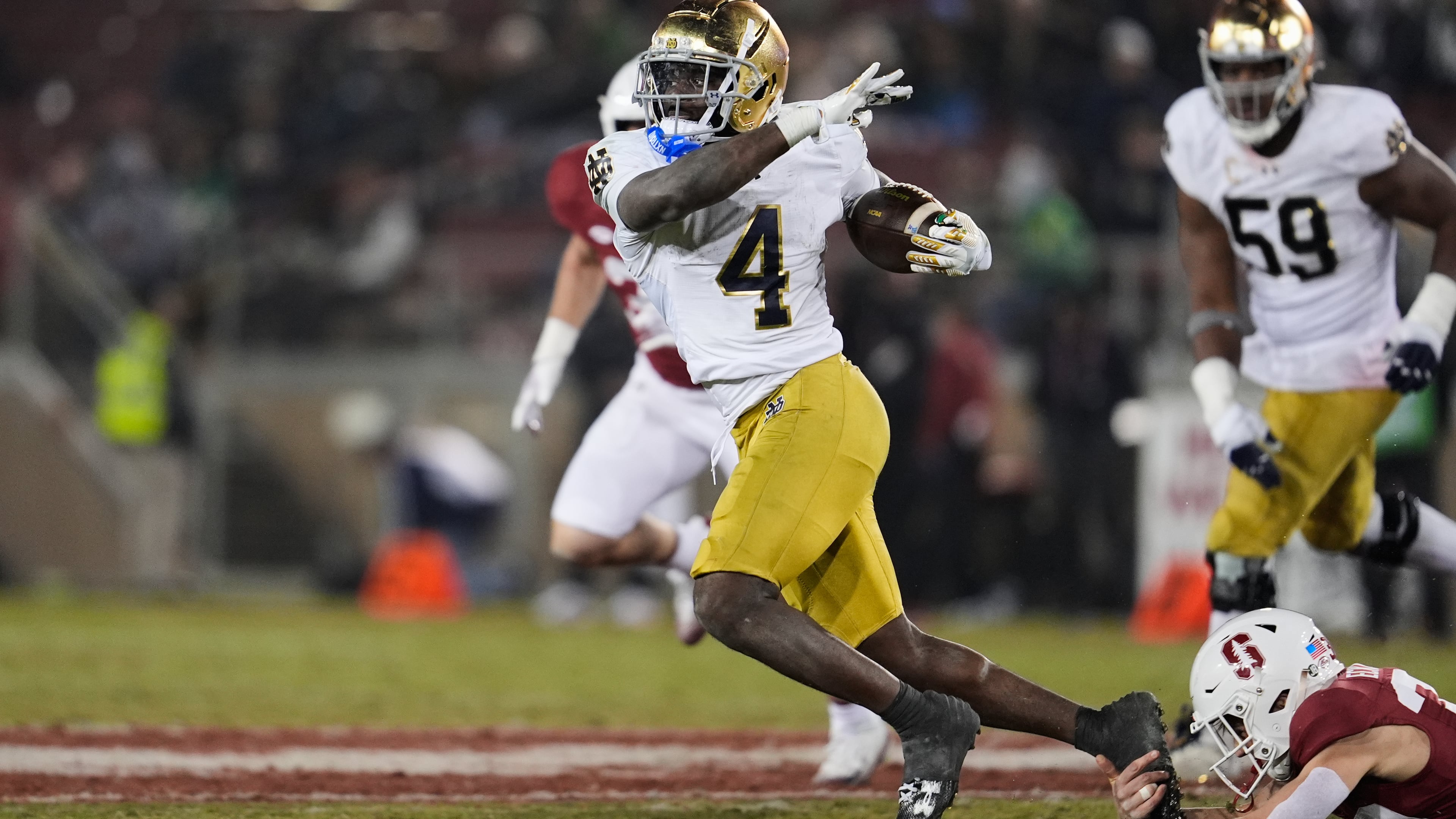 Notre Dame running back Jeremiyah Love (4) is tackled by Stanford safety Charlie Eckhardt (39) during the second half of an NCAA college football game, Saturday, Nov. 29, 2025, in Stanford, Calif. (AP Photo/Godofredo A. Vásquez)
