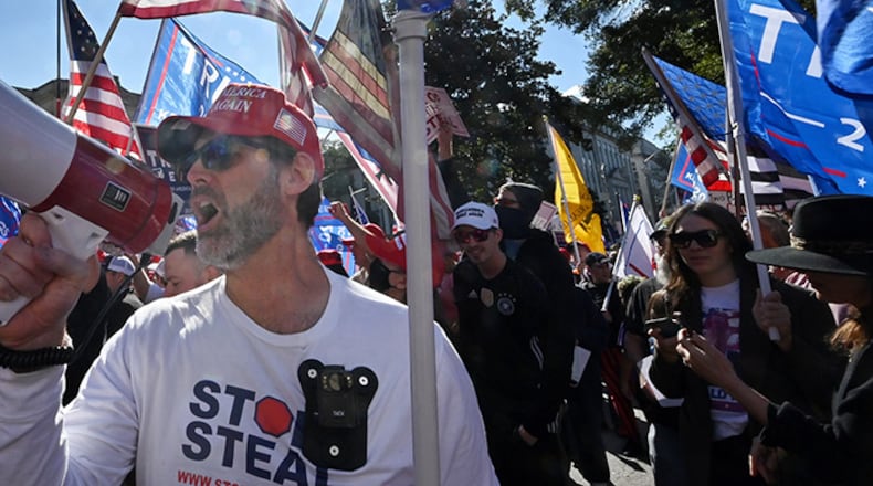 November 21, 2020 Atlanta - Pro-Trump protesters, some with flags and signs, attend a rally against the results of the U.S. presidential election outside the Georgia State Capitol on Saturday, November 21, 2020. Several different groups converged at the Capitol for a rally to show support for and against President Donald Trump. (Photo: Hyosub Shin / Hyosub.Shin@ajc.com)