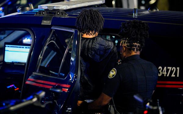 Atlanta police detain a man for questioning after the incident.