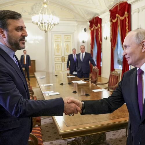 Russian President Vladimir Putin, right, shakes hands with Iranian Deputy Foreign Minister Kazem Gharibabadi, at the Boris Yeltsin Presidential Library, in St. Petersburg, Russia, Monday, April 27, 2026. (Gavriil Grigorov, Sputnik, Kremlin Pool Photo via AP)