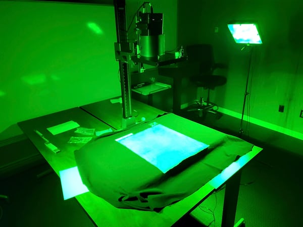 This photo provided by R.B. Toth Associates shows researchers using imaging technology on a copy of the Magna Carta from 1300 to reveal details that are not visible to the human eye on March 19, 2024, at the Weissman Preservation Center at Harvard University, in Cambridge, Mass. (R.B. Toth Associates via AP)