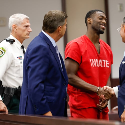 Terrion Arnold, a Detroit Lions cornerback, shakes hands with his attorneys R. Timothy Jansen, left, and A.J. Alvarez, during the conclusion of his pretrial detention hearing at the Hillsborough County Courthouse on Monday, June 29, 2026, in Tampa, Fla. (Jefferee Woo/Tampa Bay Times via AP)
