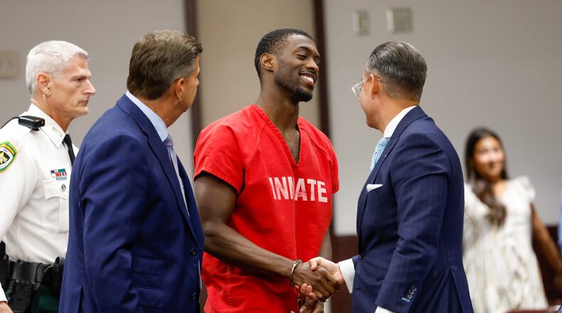 Terrion Arnold, a Detroit Lions cornerback, shakes hands with his attorneys R. Timothy Jansen, left, and A.J. Alvarez, during the conclusion of his pretrial detention hearing at the Hillsborough County Courthouse on Monday, June 29, 2026, in Tampa, Fla. (Jefferee Woo/Tampa Bay Times via AP)