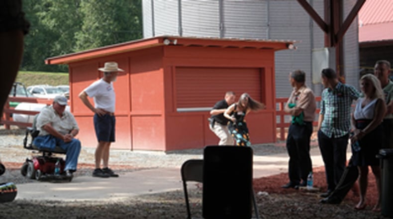 Brian Pritchchard with FetchYourNews.com captured these images of citizen journalist Nydia Tisdale being arrested by a Dawson County sheriff’s captain for filming a political rally in 2014. Tisdale was convicted of a misdemeanor Dec. 4, 2017.