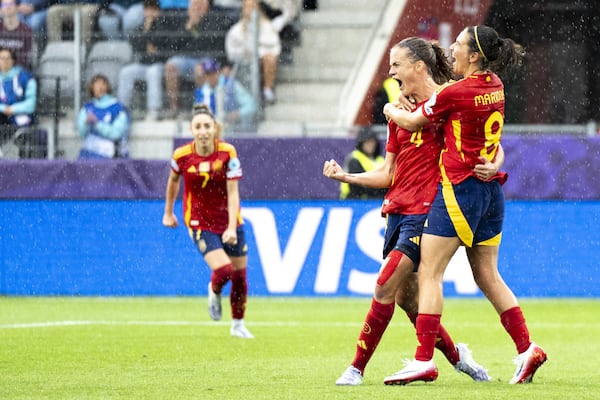 Spain's Irene Paredes, left, and Spain's Esther Gonzalez celebrate their side's second goal of the game during the UEFA Women's EURO 2025 Group B soccer match between Spain and Belgium at the Stockhorn Arena in Thun, Switzerland, Monday, July 7, 2025. (Til Buergy/Keystone via AP)