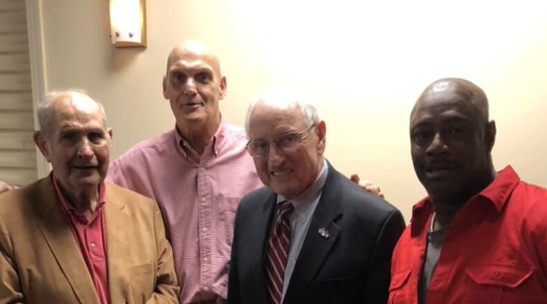 Retired Coffee football coach Bonwell Royal (left), who died May 29, is seen here with two of his best players, Joel "Cowboy" Parrish (second from left) and Andre "Pulpwood" Smith (right) along with their college coach, Georgia's Vince Dooley.
