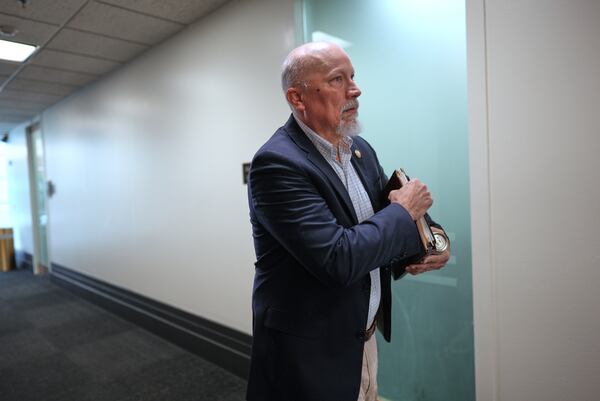 Rep. Chip Roy, R-Texas, a member of the conservative House Freedom Caucus, walks outside of the closed-door House Republican Conference as Speaker of the House Mike Johnson, R-La., talks to fellow Republicans to push for a House-Senate compromise budget resolution to advance President Donald Trump's agenda, at the Capitol in Washington, Tuesday, April 8, 2025. (AP Photo/J. Scott Applewhite)
