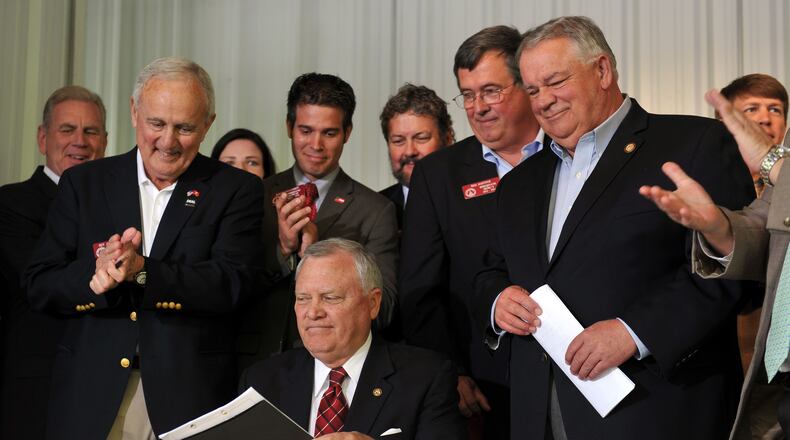 April 23, 2014. Ellijay, GA: Governor Nathan Deal signed House Bill 60 into law during a signing event in Ellijay, GA. The gun law is a broad loosening of Georgia's gun restrictions. BRANT SANDERLIN /BSANDERLIN@AJC.COM . Deal deal deal