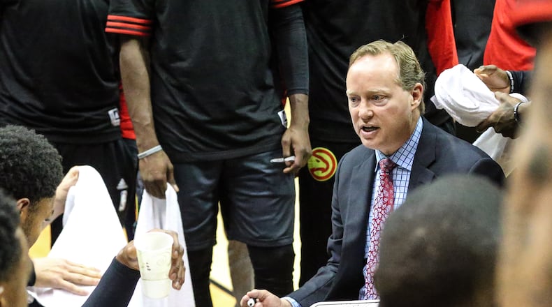 Atlanta Hawks head coach Mike Budenholzer speaks during a timeout in the first half of an NBA preseason basketball game against the New Orleans Pelicans in Jacksonville, Fla., Friday, Oct. 9, 2015. (AP Photo/Gary McCullough)