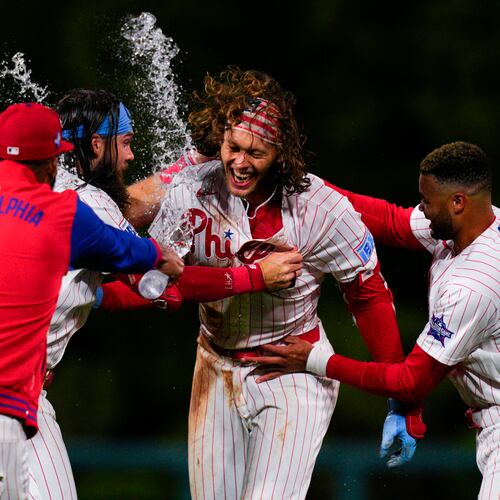 Philadelphia Phillies' Alec Bohm, secind from right, celebrates with teammates after his walkoff sacrifice fly during the 10th inning of the second baseball game of a doubleheader against the San Francisco Giants, Thursday, April 30, 2026, in Philadelphia. (AP Photo/Derik Hamilton)