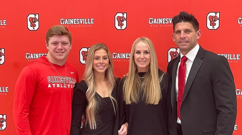 Josh Niblett (right) was introduced as Gainesville's new football coach on Monday, Dec. 13, 2021, with his children (from left) Josh and Sky, and wife, Karon.