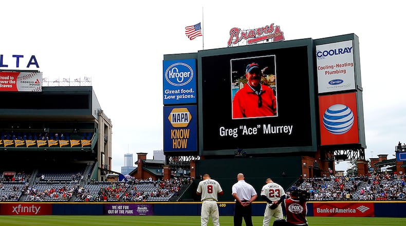 ATLANTA, GA - AUGUST 30: An American flag is lowered to half-staff in memory of a fan, Greg "Ace" Murrey, who fell to his death at the game between the Atlanta Braves and the New York Yankees on August 29, 2015, at Turner Field in Atlanta.