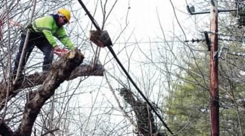 Look Up! Pedestrians in Brookhaven should be cautious about falling limbs on streets where tree trimming is taking place.