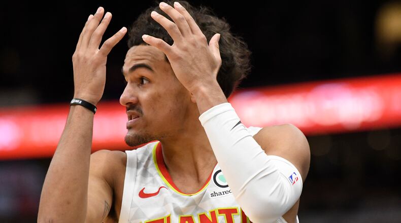 Atlanta Hawks guard Trae Young (11) reacts after being called for a foul against the Chicago Bulls during the second half of an NBA basketball game, Wednesday, Dec. 11, 2019, in Chicago. (AP Photo/David Banks)