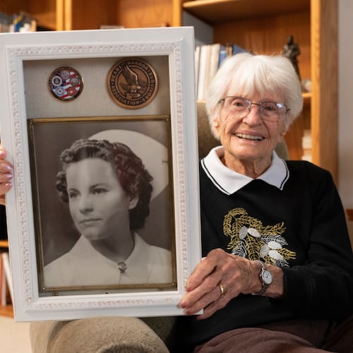 Alice Darrow shows a photo of herself from when she was a nurse during World War II, Thursday, Oct. 23, 2025, at her home in Danville, Calif. (AP Photo/Laure Andrillon)