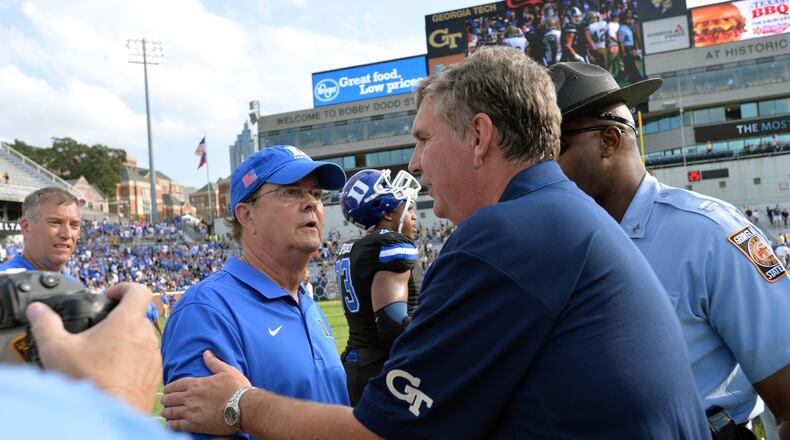 October 11, 2014 Atlanta - Georgia Tech Yellow Jackets head coach Paul Johnson (right) shakes hands with Duke Blue Devils head coach David Cutcliffe after losing to the Duke Blue Devils at Bobby Dodd Stadium on Saturday, October 11, 2014. HYOSUB SHIN / HSHIN@AJC.COM