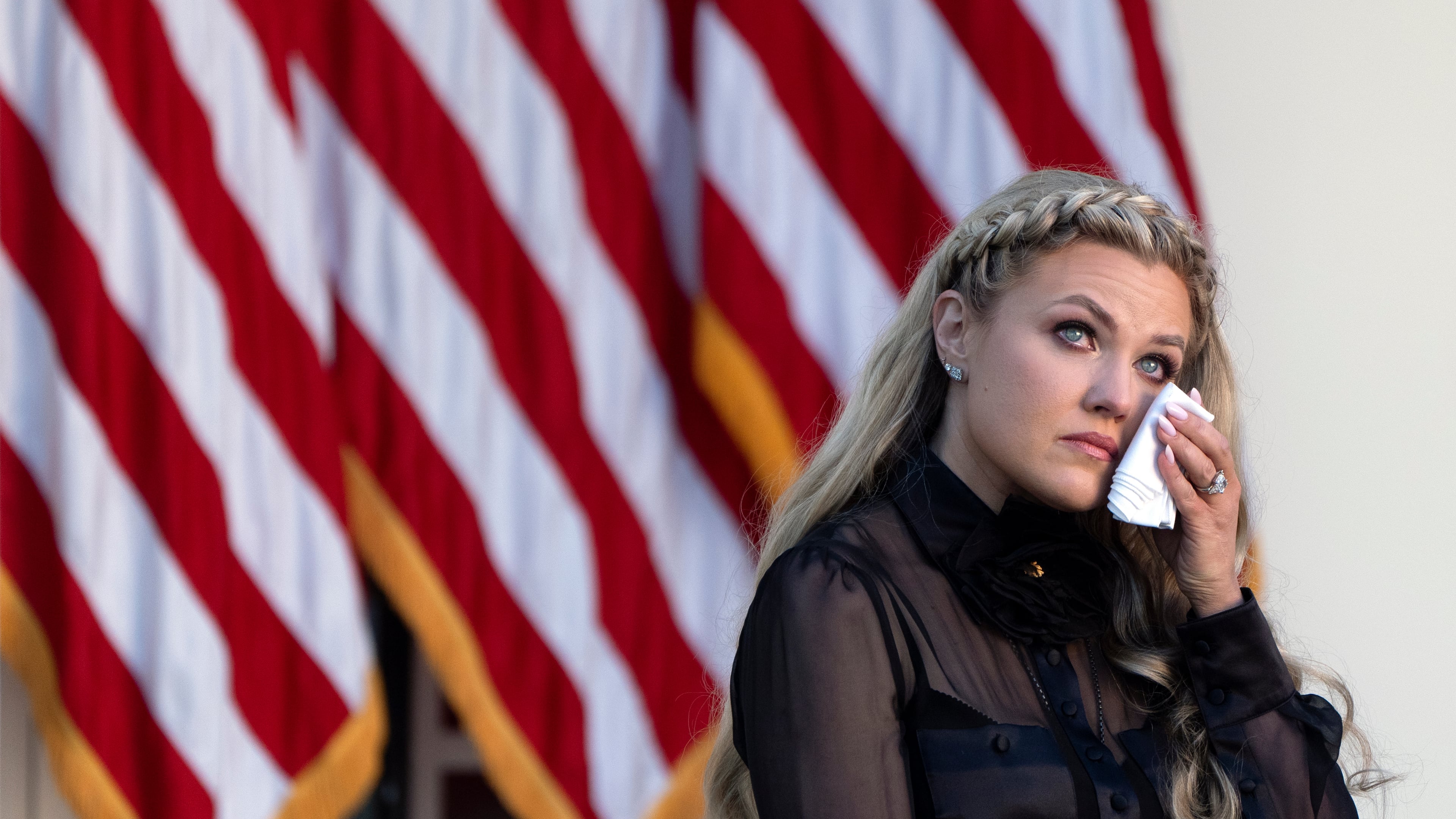 Erika Kirk reacts after President Donald Trump posthumously awarded the Presidential Medal of Freedom to her late husband Charlie Kirk, in the Rose Garden of the White House, Tuesday, Oct. 14, 2025, in Washington. (AP Photo/Mark Schiefelbein)