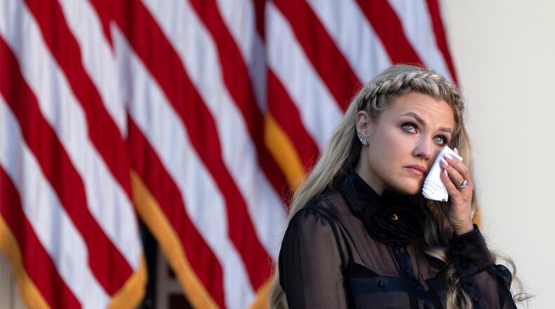 Erika Kirk reacts after President Donald Trump posthumously awarded the Presidential Medal of Freedom to her late husband Charlie Kirk, in the Rose Garden of the White House, Tuesday, Oct. 14, 2025, in Washington. (AP Photo/Mark Schiefelbein)