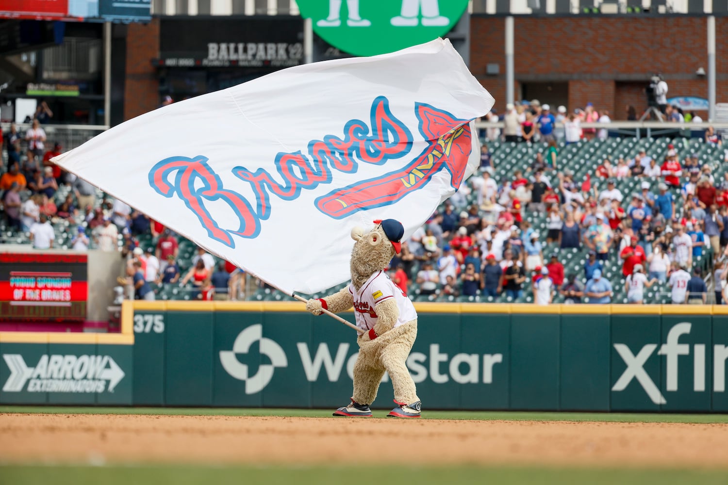 Atlanta Braves mascot, the Blooper, waves the flags after the Braves defeated the Minnesota Twins -62 to sweep the series at Truist Park on Sunday, April 20, 2025.
 (Miguel Martinez/ AJC)