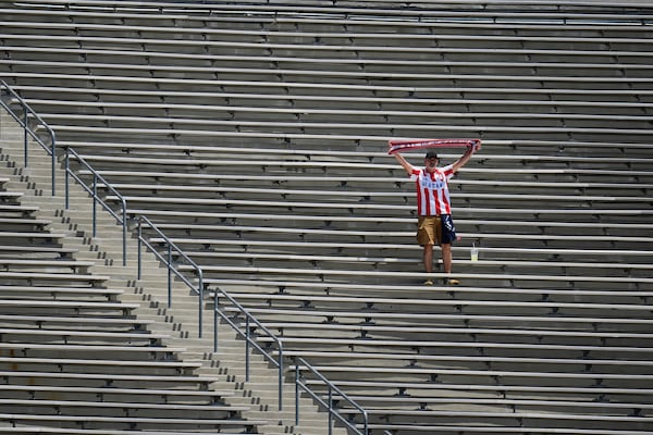 A fan from Atletico Madrid cheers prior to the Club World Cup Group B soccer match between Atletico Madrid and Botafogo in Pasadena, Calif., Monday, June 23, 2025. (AP Photo/Greg Bull)